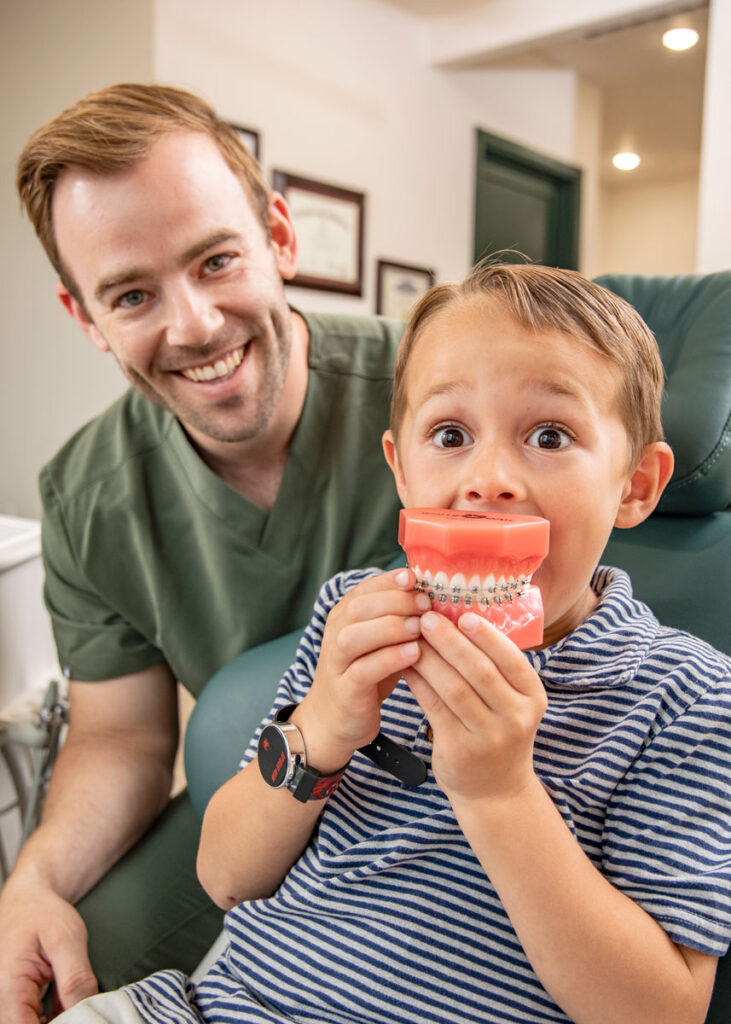 Dr. Brock Frazee with a kid orthodontics patient